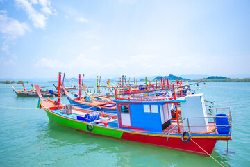 Fishing boat with colorful color on the sea water. Vintage travel style. Wooden fishing boat.
