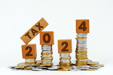 Tax 2024 text on wood. Concept of paying taxes in 2024.