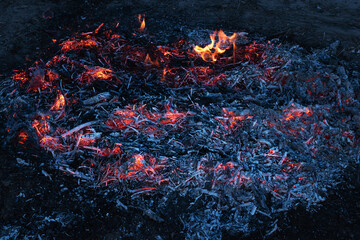 Burning coals. Decaying charcoal. Texture embers closeup. Burning charcoal in the background....