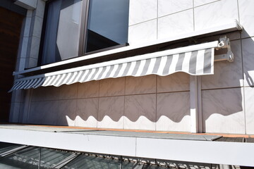 striped white and blue awning