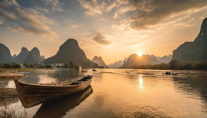 guilin over the sunsets with boat on the river - obrazy, fototapety, plakaty