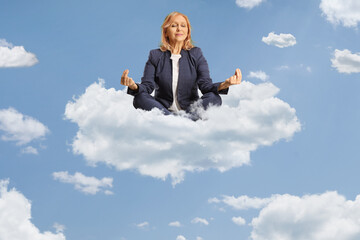 Woman sitting and practicing meditation on a cloud