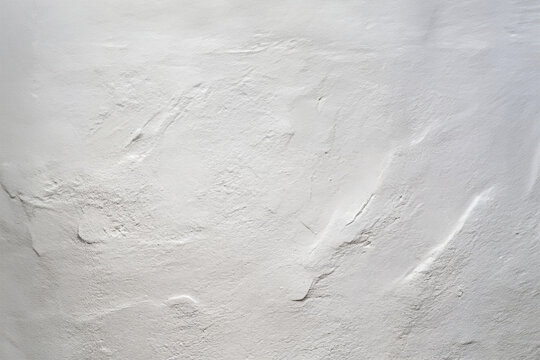 cement rendered wall painted white