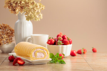 Homemade strawberry biscuit cake roll with fresh berries.