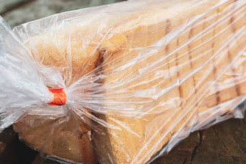 close up of wrapped package of sliced white bread
