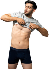Muscular beard Caucasian male model in black shorts putting on T shirt PNG file no background 