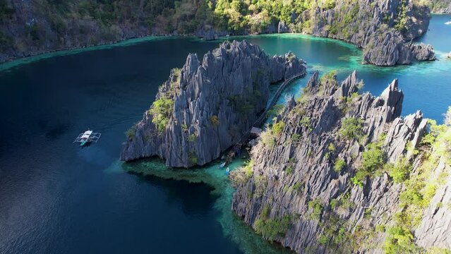 4K Drone video flying over Twin Lagoon with beautiful cliffs, Coron, Palawan Philippines