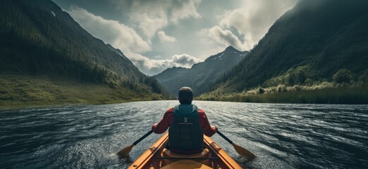 Witness the exhilaration of outdoor adventure as a young man navigates whitewater rapids in a kayak, amidst the rugged beauty of mountain scenery. - obrazy, fototapety, plakaty