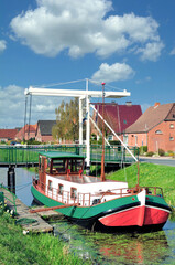 Fototapeta na wymiar idyllic Moorland Canal called Fehnkanal in East Frisia,lower Saxony,Germany