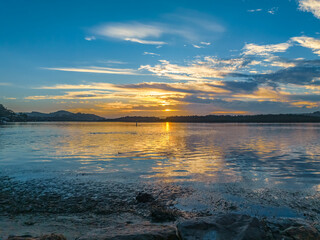 Sunrise, clouds, blue sky and water - a perfect day