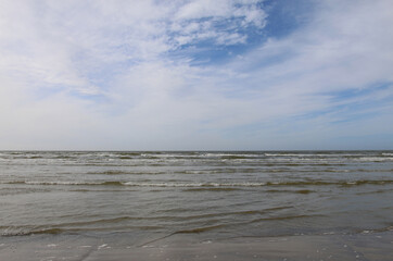 Fototapeta na wymiar Baltic sea with blue sky and clouds in spring