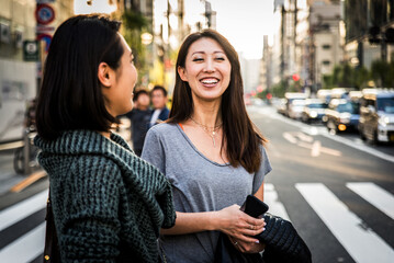 Two female friends meeting in Tokyo