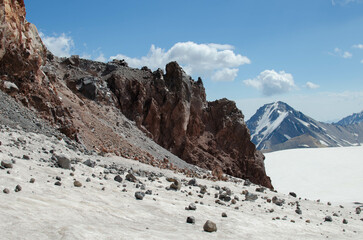 crumbled stones at the foot of the cliff