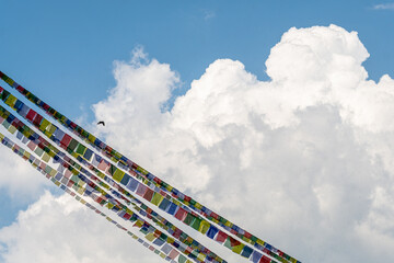 tibetan prayer flags isolated at blue sky background  - 778830047