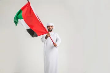 Foto op Plexiglas Handsome middle-eastern man wearing emirate traditional clothing portrait in studio © oneinchpunch