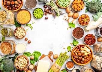 Vegan food background with empty space. Plant protein., vegetarian nutrition sources. Healthy eating, diet ingredients: legumes, beans, lentils, nuts, soy milk, tofu, cereals