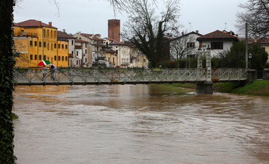 Raging river during flooding with risk of overflow in Northern Italy
