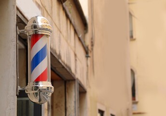 Barber shop s rotating striped pole sign with spiral design