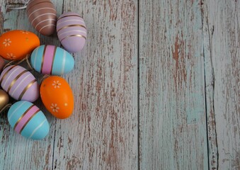 a banner with colorful Easter eggs on a gray background with free space for text insertion