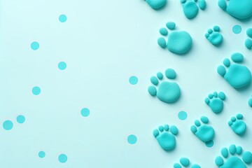Cyan paw prints on a background, minimalist backdrop pattern with copy space for design or photo, animal pet cute surface 