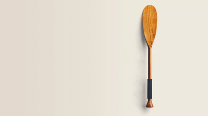 Wooden canoe paddle against a textured paper backdrop.