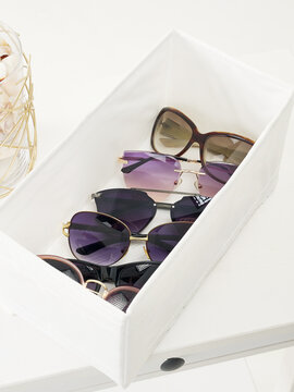 open box with sunglasses set. glasses still life