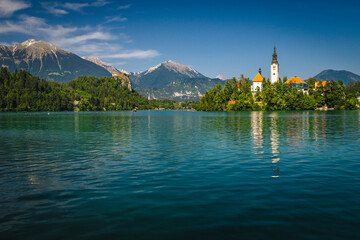 Amazing view with famous chuch on the green island, Slovenia
