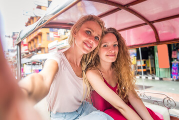 Female best friends visiting Thailand landmarks - Tourists exploring Bangkok, Thailand
