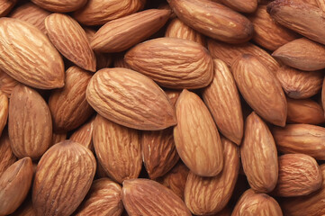 Close up of almond nuts background. Healthy food concept.
