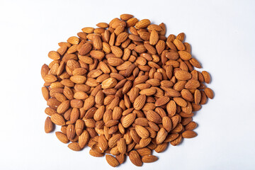 Pile of almonds on white background. Healthy food concept.