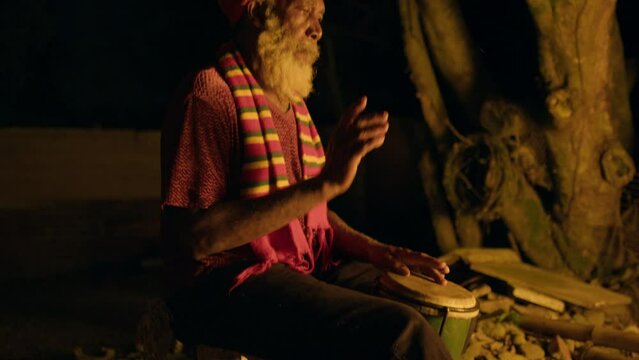 Rasta Man Drumming on the drum