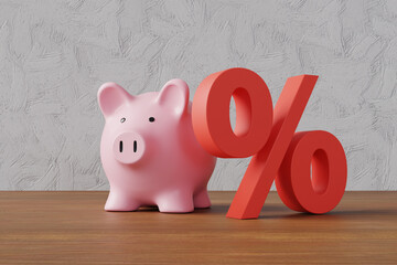 Pink piggy bank standing next to a red percentage sign on wooden table in front of a white plaster wall. Illustration of the concept of interest rate of savings and mortgage, and compound interest