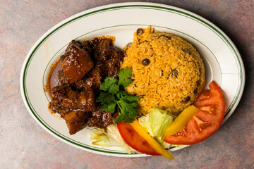 Stewed beef with yellow rice and pigeon peas