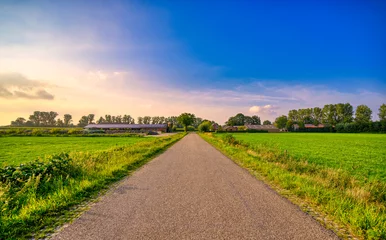 Foto auf Leinwand Country road in the Dutch province of Noord-Brabant near the village of Aarle-Rixtel, The Netherlands. © Alex de Haas