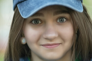 Portrait of a young beautiful long-haired girl in an urban environment.