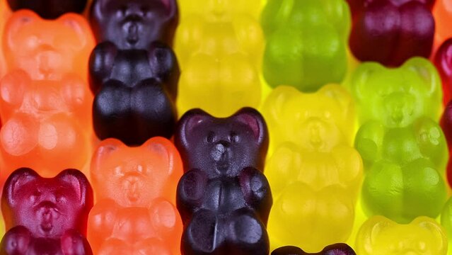 HD Jelly bears or Gummy bears video background. Close up view on bright candy background with jelly candies