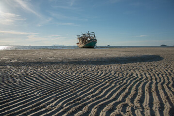 Fototapeta premium Wreck of a fishing boat on the beach
