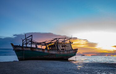 Wreck of a fishing boat on the beach