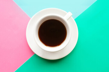 Coffee cup on color background, top view. Minimal concept.