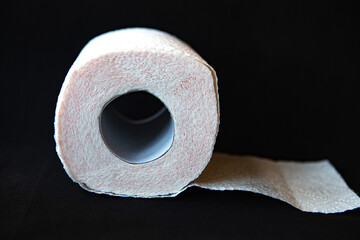 toilet paper roll on black background, quarantine concept.