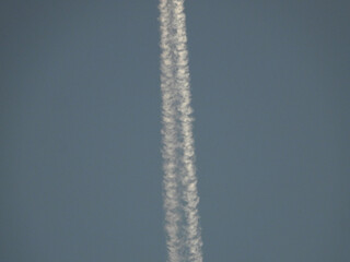 Low angle view of airplanes contrail
