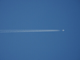 Low angle view of airplanes contrail