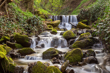 waterfalls along a mountain stream - 778908633