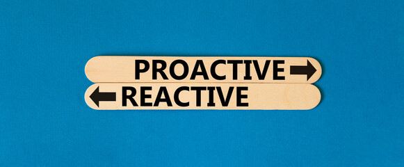 Proactive and reactive symbol. Concept word Proactive Reactive on beautiful wooden stick. Beautiful...
