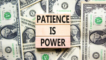 Patience is power symbol. Concept words Patience is power on beautiful wooden blocks. Dollar bills. Beautiful dollar bills background. Business and patience is power concept. Copy space.