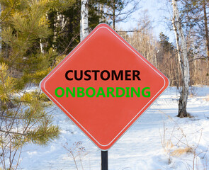 Customer onboarding symbol. Concept words Customer onboarding on beautiful red road sign. Beautiful forest snow blue sky background. Business Customer onboarding concept. Copy space.