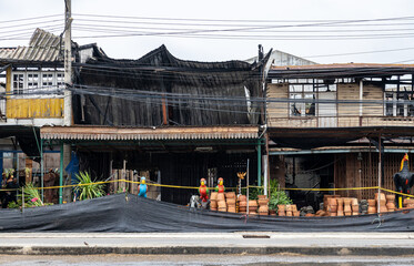 A view of the condition of a two-storey wooden house next to each other which was damaged.