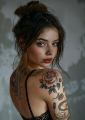 Beautiful young woman with tattoos. Fashion woman with creative style. Modern fashion portrait of bold girl with make-up, dark dress
