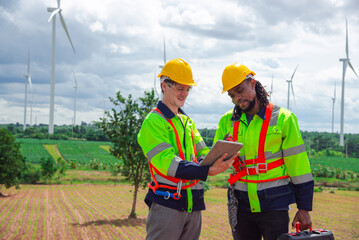 Technicians at construction site of wind turbine checking and maintanance Electricity wind generator