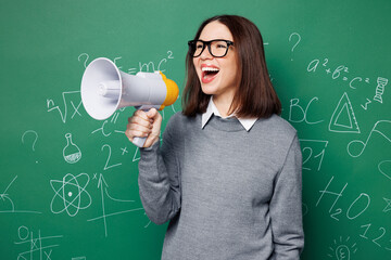 Young smart teacher woman wears grey casual shirt glasses hold in hand megaphone scream announces...